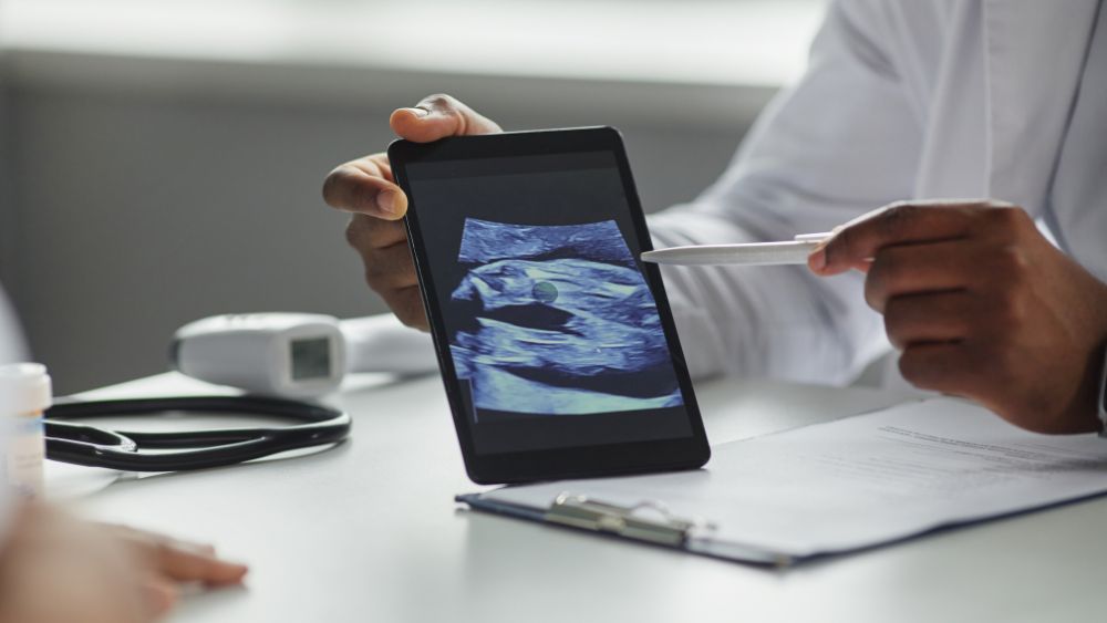Doctor Explaining Pregnancy Ultrasound Report - NRKSS Blog